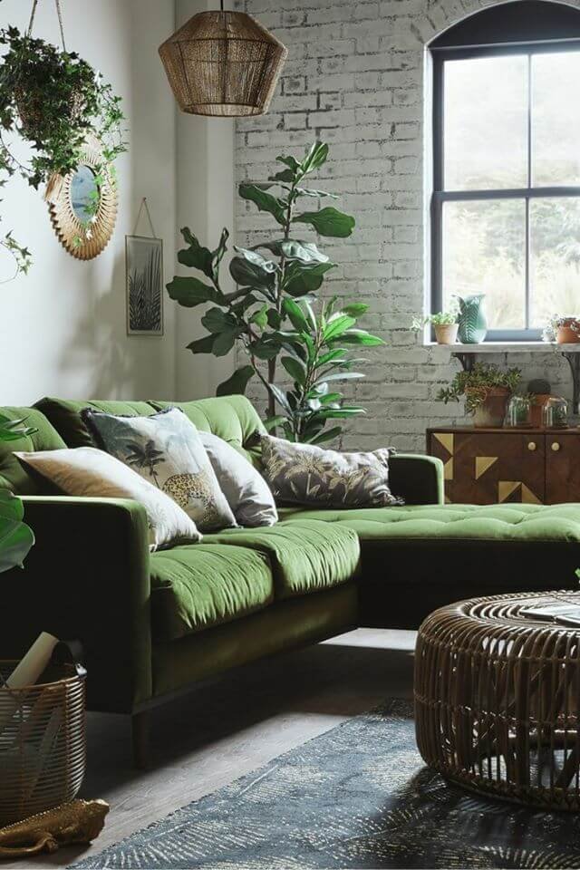 Living room with exposed brick walls whitewashed in industrial boho style