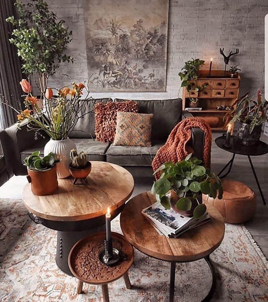 indie boho living room with coffee tables and greenery