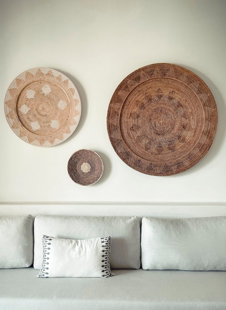 Woven plates on the wall in modern boho design