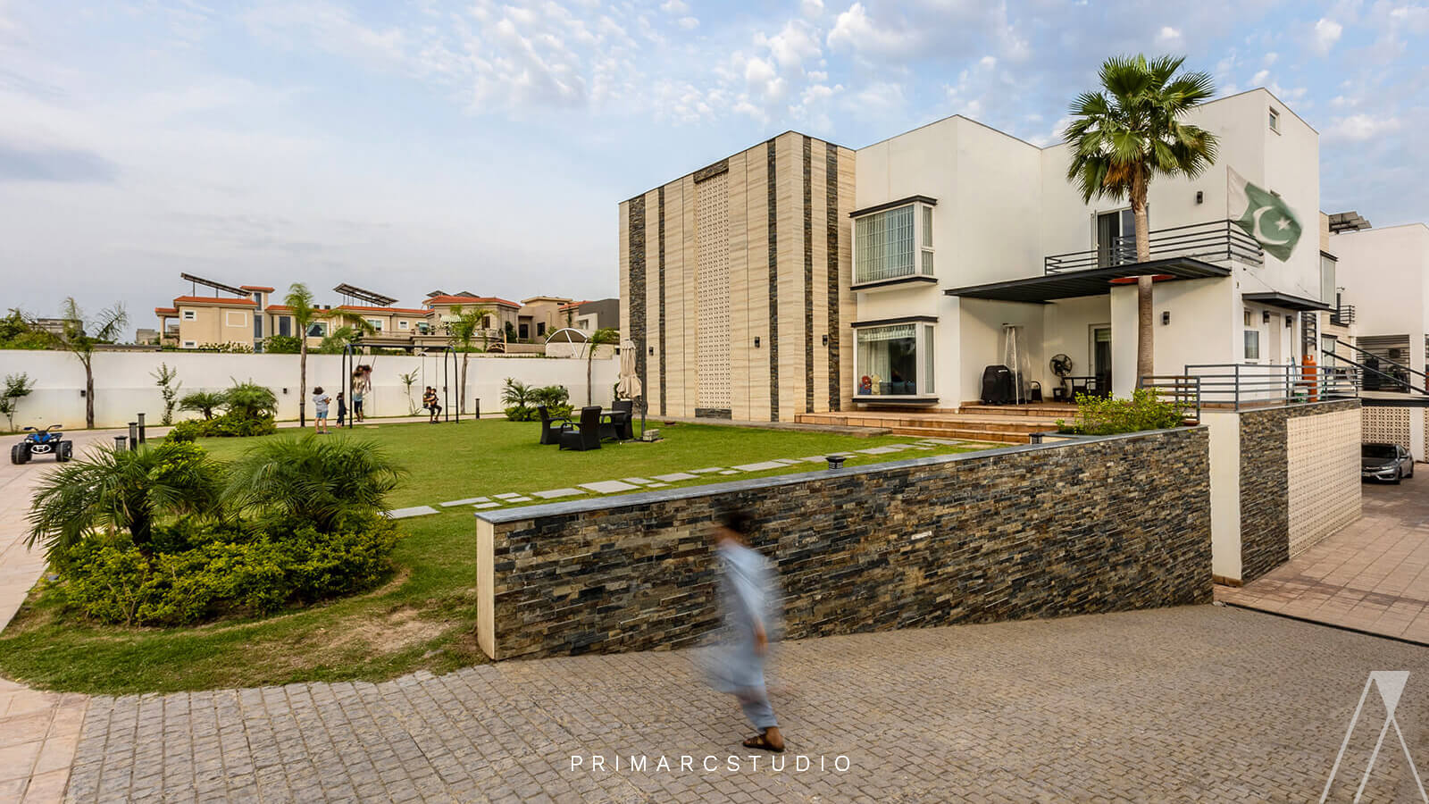 Modern farm house design with child running infront of lush green lawn