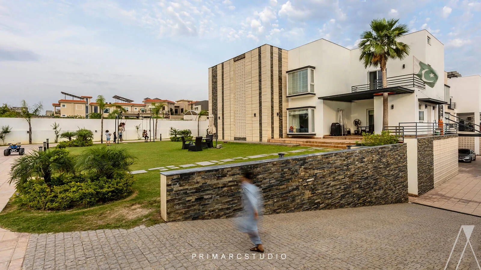 Modern farm house design with child running infront of lush green lawn