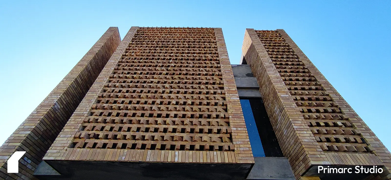 Close-up of gutka brick cladding on the facade of a 5 marla house in Pakistan. The detailed texture and craftsmanship emphasize the high-quality brickwork used in modern exterior designs.