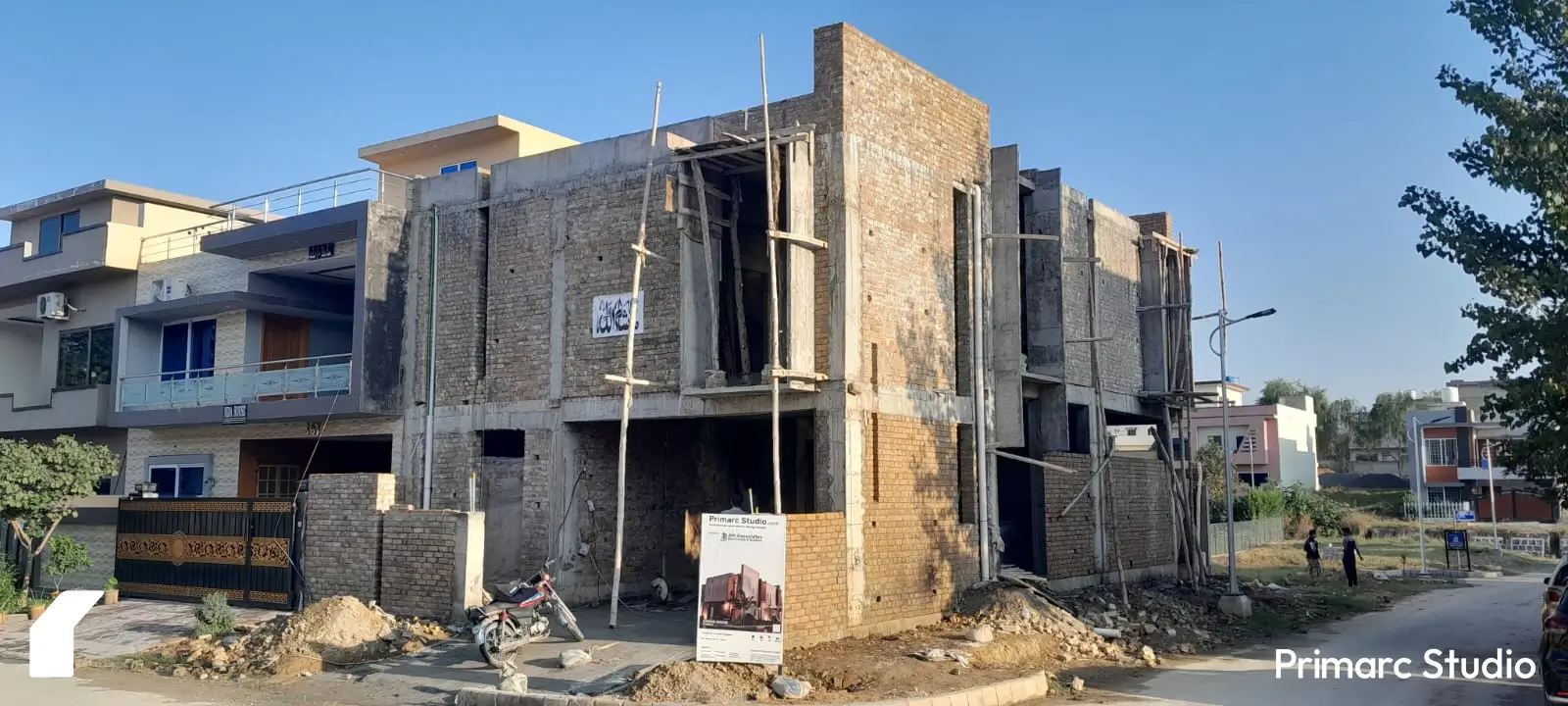 Front view of a 7 marla house under construction in B-17, Sector C, Islamabad, showcasing modern architectural design and structural progress.