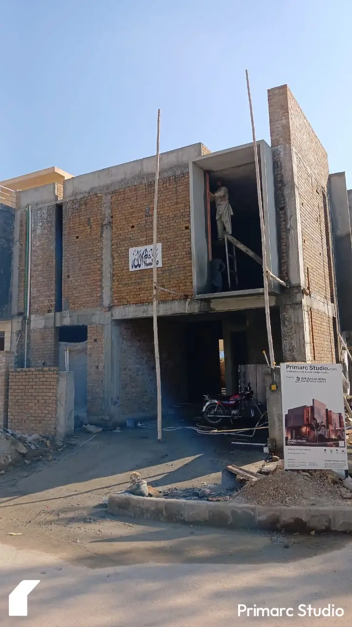 Closeup of the exterior view of a 7 marla house under construction in B-17, Sector C, Islamabad, showing spacious layout and structural features.