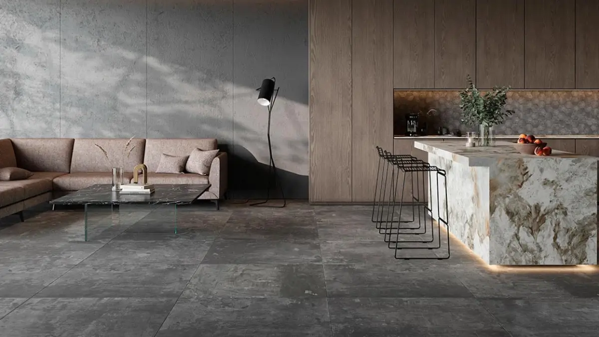 Minimalist living room with gray concrete tile flooring, a modern coffee table, and comfortable chairs.