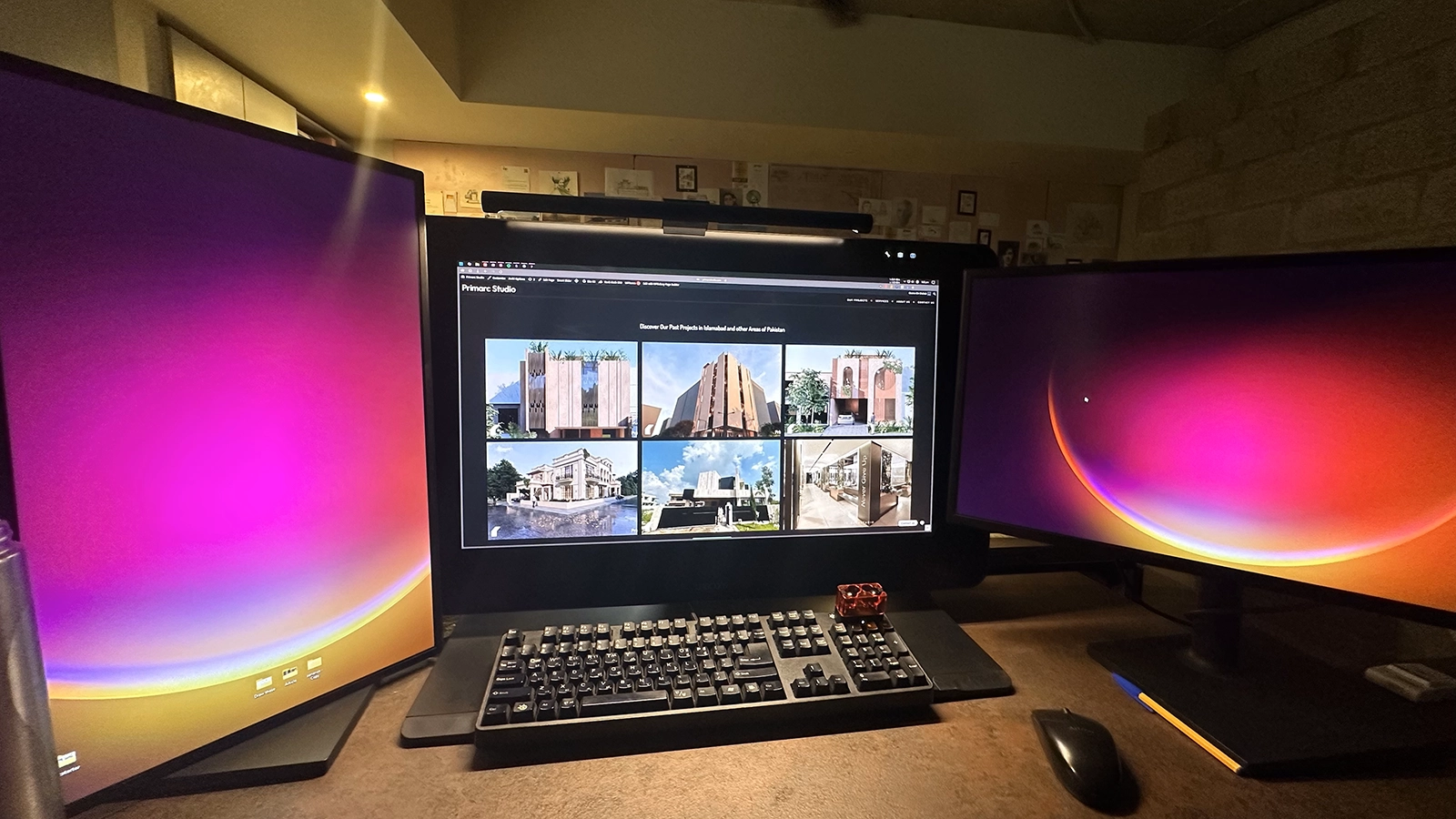 Xiaomi monitor light bar illuminating the desk with three monitor setup