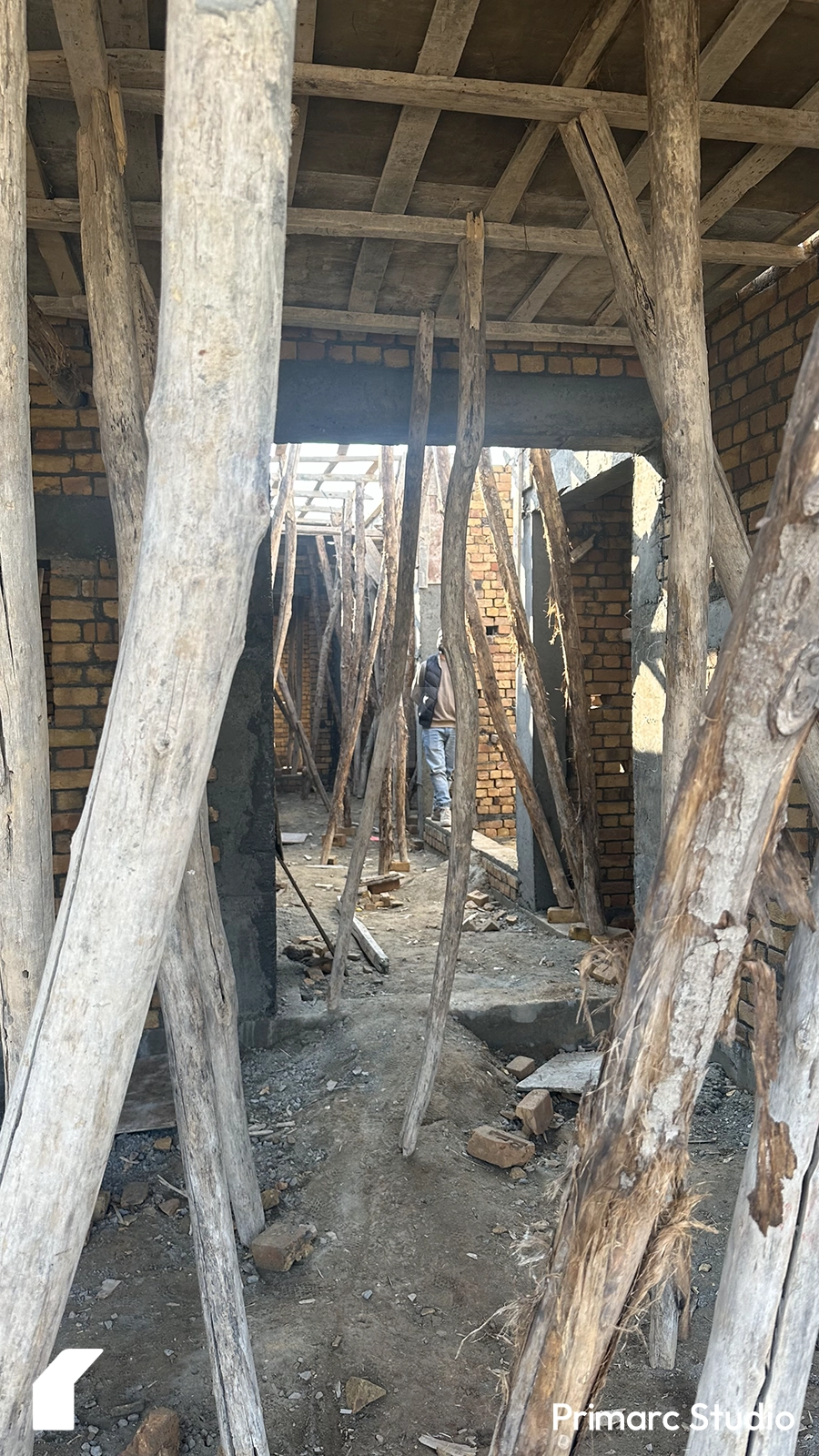 View of the shuttering in place and Architect viewing the spaces.