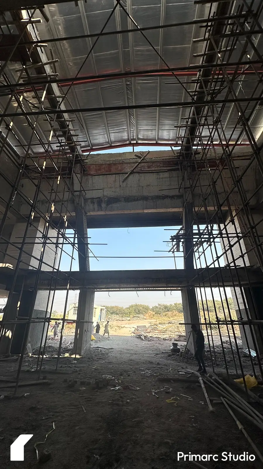 Close-up of the scaffoldings inside the modern marquee in Islamabad, highlighting the massive scale of the interior space. The towering structure emphasizes the grandeur and contemporary design of the venue under construction.