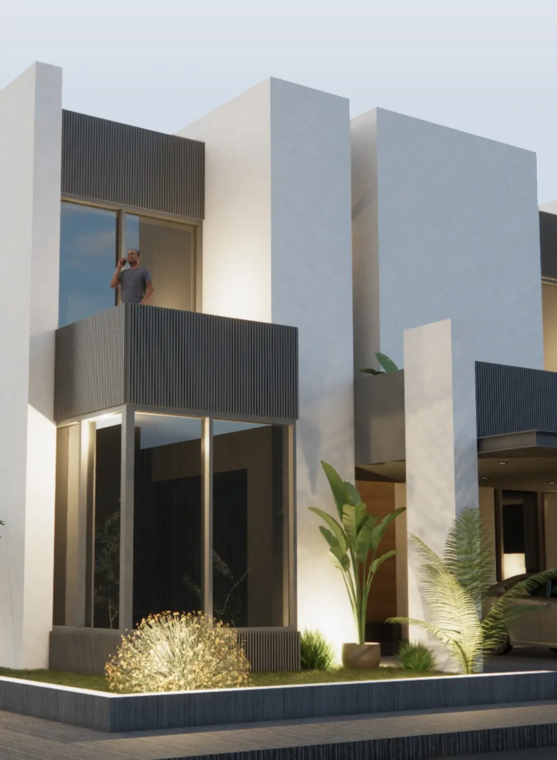 A detailed view of the modern one kanal Amir Yaqoob House in Islamabad, showcasing its cubic architectural elements, large windows, and a balcony with a person. Illuminated landscaping and potted plants enhance the contemporary design.