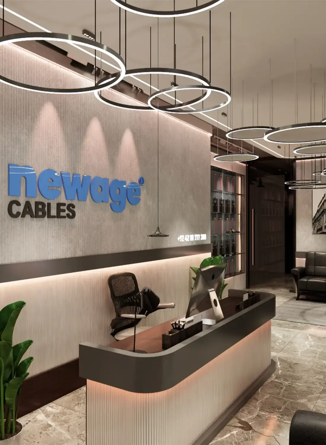 Inviting reception area of Newage Cables regional office in G-8, Islamabad, designed by Primarc Studio. Features a contemporary reception desk, clear company branding ("Newage Cables"), ambient circular lighting fixtures, and a comfortable waiting space.