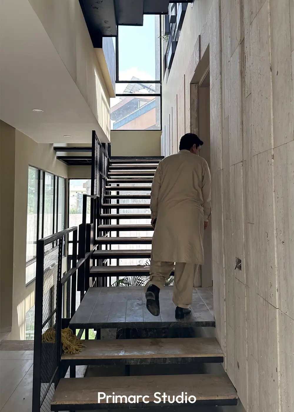 View of the modern staircase within the Islamabad residence, illustrating the dynamic levels and vertical circulation in this architect-designed contemporary home.