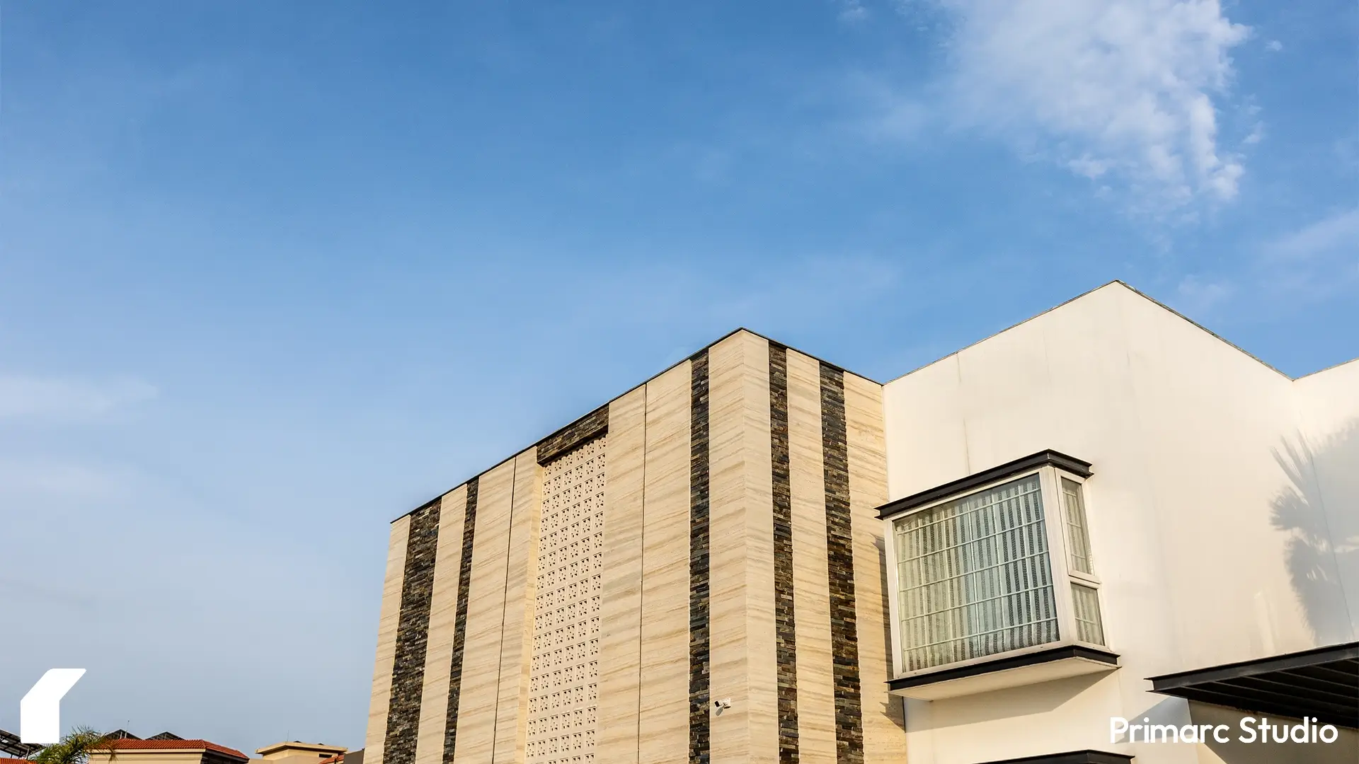 A view of the upper section of a farm house facade in Gulberg Greens, Islamabad, redesigned by Primarc Studio. The image focuses on the modern architectural details and the use of materials on the exterior. It represents the quality of architecture design services offered by Primarc Studio for luxury real estate in Islamabad.