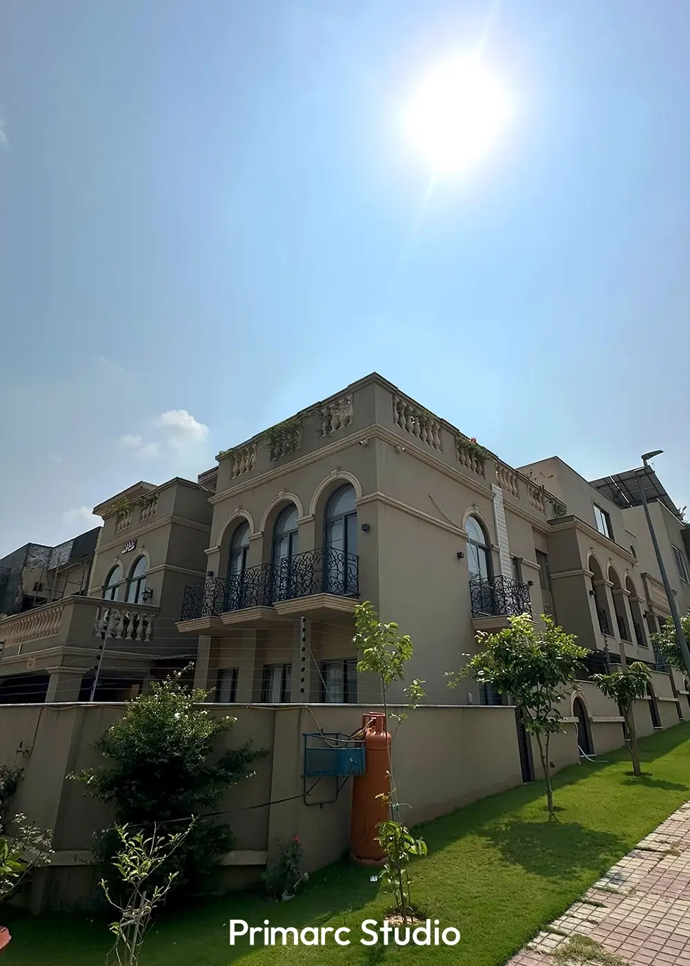 Close-up view of the upper floor balcony and terrace of Noman House, a 1 kanal classical house in DHA Phase 2 Islamabad, with ornate iron railing and balustrades.