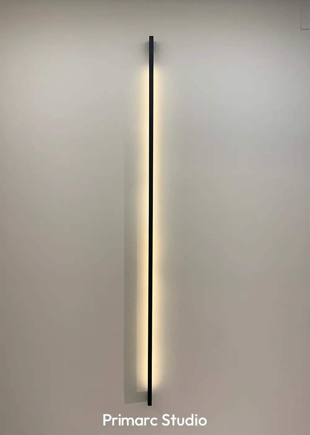 Sleek vertical LED wall light in a contemporary 10 marla house design Gulberg Residencia Islamabad.